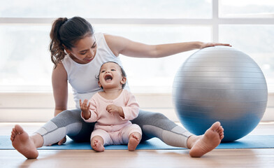 Woman, happy baby and floor with exercise ball, laughing and bonding together with fitness, health...