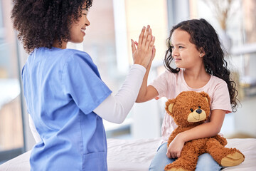 Fototapeta High five, nurse and child on bed in hospital for children, health and support in medical treatment. Pediatrics, healthcare and kid, nursing caregiver touching hands with young patient and teddy bear obraz