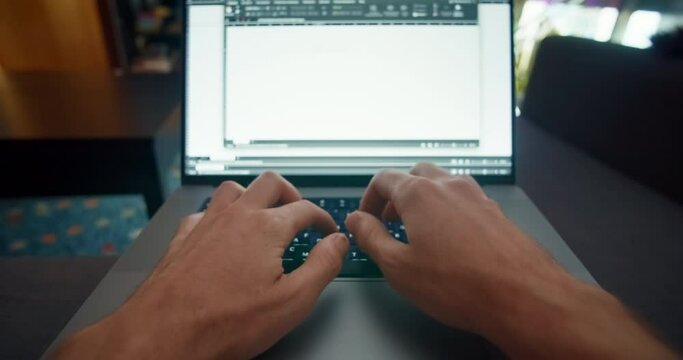 First person perspective man working at home using laptop computer