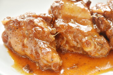  fried chicken drumsticks dressing sweet gravy sauce on plate