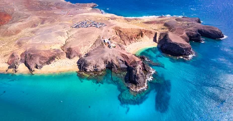 Poster Lanzarorote Canary islands beach scenery. Aerial drone panoramic high angle view of popular scenic Papagayo beach in the south. © Freesurf