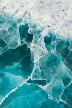 Surface with cracked blue ice cubes