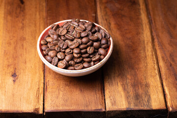 Obraz na płótnie Canvas Premium Colombian Coffee Beans on Wooden Plank