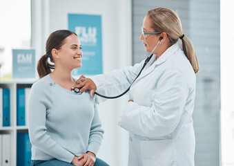 Healthcare, doctor exam with woman patient and consultation with stethoscope at a hospital. Medicine or health wellness, cardiology and surgeon medical test with a female person in a clinic building - obrazy, fototapety, plakaty