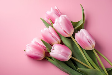 Bouquet of pink tulips on pink background. Mothers day, Valentines Day, Birthday celebration concept. Greeting card. Copy space for text, top view. Generative ai