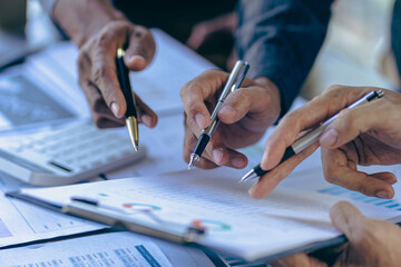 Business people meeting explain financial graph data and marketing plan, assess status of business investment and marketing and brainstorm new business project, financial investment concept.