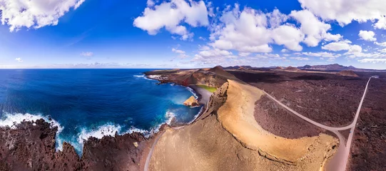 Poster Lanzarote, Canary islands scenery. Aerial drone panoramic view of El Golfo with volcanic green lake Lago Verde and black sandy beach.. © Freesurf