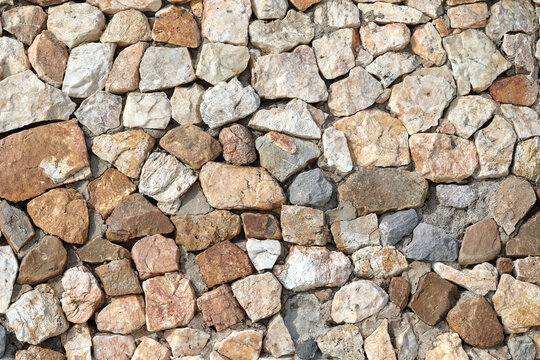 Granite stone wall, pattern of natural gray granite stone wall for background.