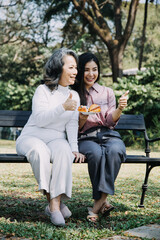 Happy senior woman enjoying in daughter's affection on Mother's day.