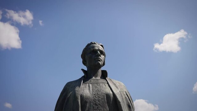 The statue of Lesya Ukrainka against the background of the sky