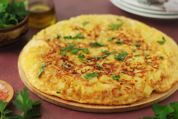 Frittata, traditional egg and potato omelette, Italian dish