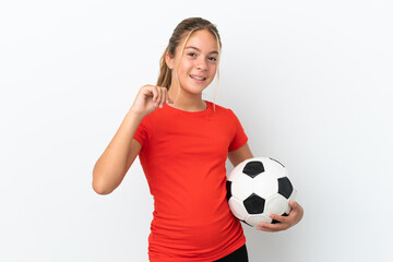 Little caucasian girl isolated on white background with soccer ball and proud of himself