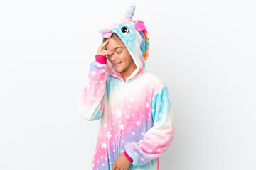 Little girl with unicorn pajamas isolated on white background laughing