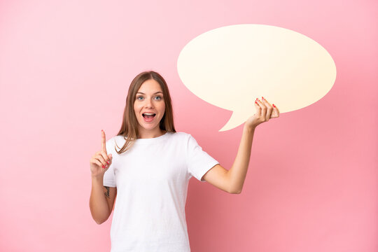 Young Lithuanian Woman Isolated On Pink Background Holding An Empty Speech Bubble With Surprised Expression