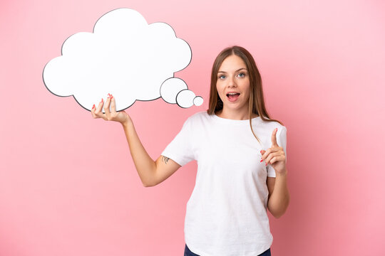 Young Lithuanian woman isolated on pink background holding a thinking speech bubble