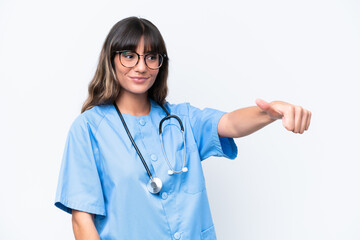 Young caucasian nurse woman isolated on white background giving a thumbs up gesture