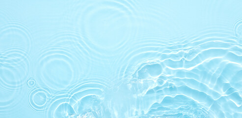Water blue surface abstract background. Waves and ripples of cosmetic moisturizer with bubbles