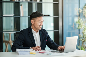 Asian business man working at table office, business finance technology, financial document and...
