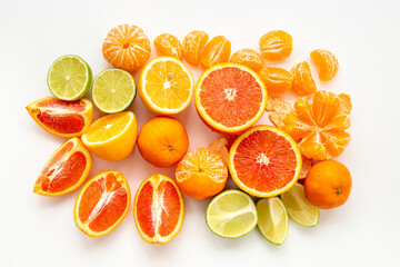 Many different citrus fruits leaves on white background, top view