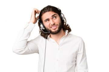 Telemarketer man working with a headset over isolated chroma key background having doubts and with confuse face expression