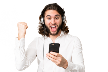 Telemarketer man working with a headset over isolated chroma key background surprised and sending a message