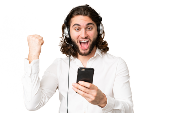 Telemarketer man working with a headset over isolated chroma key background surprised and sending a message