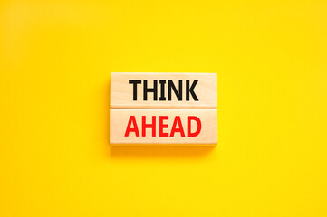 Think ahead symbol. Concept words Think ahead on wooden blocks on a beautiful yellow table yellow background. Business, support, motivation, psychological and think ahead concept. Copy space.