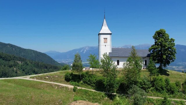 Aerial morning view of St. Primoz church at Jamnik, Slovenia, Julian alps.