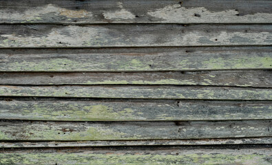 Old wooden wall with worn out paint