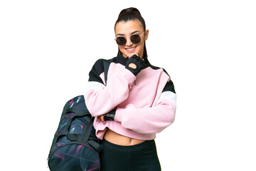 Young sport woman with sport bag over isolated chroma key background with glasses and smiling