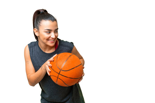 Young Beauty Woman Over Isolated Chroma Key Background Playing Basketball