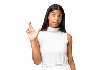 Young African american woman over isolated background with fingers crossing and wishing the best