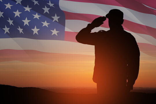Silhouette of soldier saluting on a background of USA flag. Greeting card for Veterans Day, Memorial Day.
