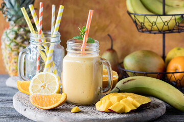 A smooth and creamy mango citrus smoothie, ready for drinking.