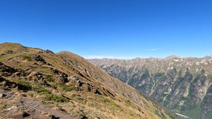 Fototapeta na wymiar mountainscape, picture of Arkhyz mountains at autumn with blue sky - photo of nature