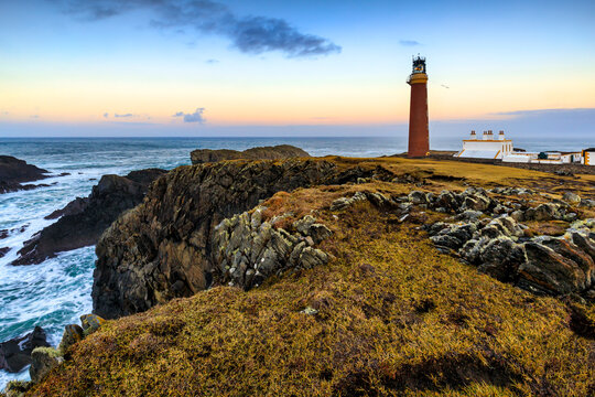 Butt of lewis lighthouse at sunset, located on the rugged coastline in the isle of Lewis, Outer Hebrides, Scotland.