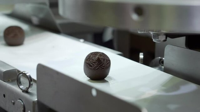 The movement of the candy production line.