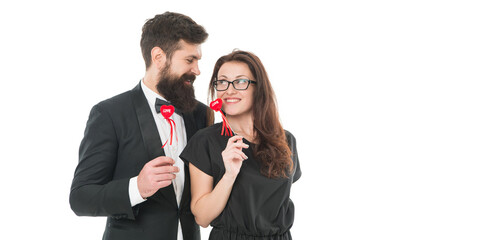 Deep in love. elegant couple formal event party. love and romance. romantic date for man and woman. happy valentines day. tuxedo man beard. business lady in glasses. formal couple in love hold heart