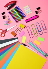 Assorted school supplies, vertical shot and zenith view.