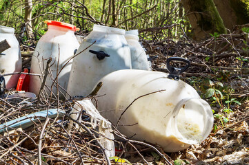 Construction debris in the woods. Forest and household waste. Pollution of the environment.