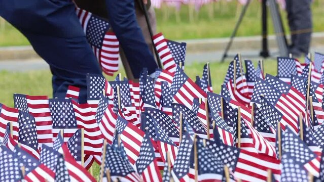 Boston Common, May 25, 2023. Boston Celebrate Memorial Day, Read Aloud Every Soldier Who Died and People planting an American flag Accordingl