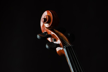 Violin, details of a beautiful violin on rustic wood, low key style photo, black background,...