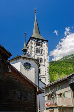 Beautiful bell tower of St. Mauritius Church of Naters, Brig, Canton of Valais, Switzerland. The urbanized village of Naters is part of the Inventory of Swiss Heritage Sites