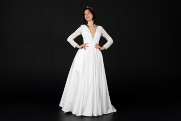 Fototapeta na wymiar Beautiful bride in elegant exquisit white dress. isolated on black background.