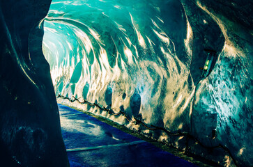 Light show in the ice cave of the famous Mont Blanc sea of ice
