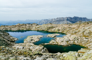 Black lake in the Chamonix valley with view on mountain landscape