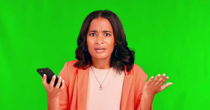 Green screen, angry and young woman on a phone call or scam alert app or upset and annoyed in a studio background. Employee, confused and female model with communication problem or spam or on mock up