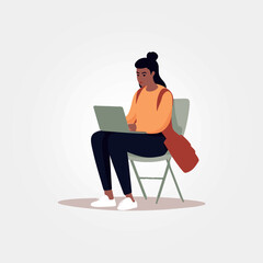 woman sitting with laptop on her lap