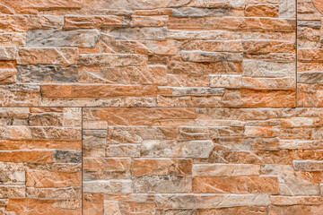 Texture of colored decorative stone wall, slabs with abstract tile patterns background
