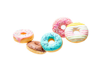 Sweet donuts of different bright colors in flight on a blue background